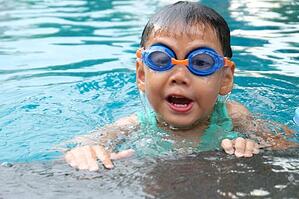 Boy Swimming in Pool
